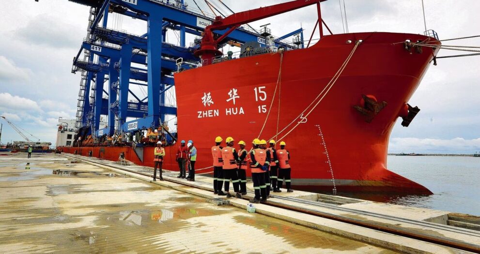 Chinese cargo ship Zhen Hua 29 carrying giant port cranes on a long international voyage.