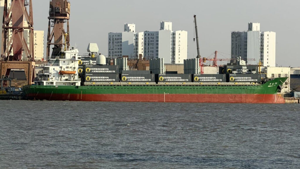 Chinese cargo ship carrying containerized modular missile launchers, highlighting the dual-use potential of commercial shipping vessels