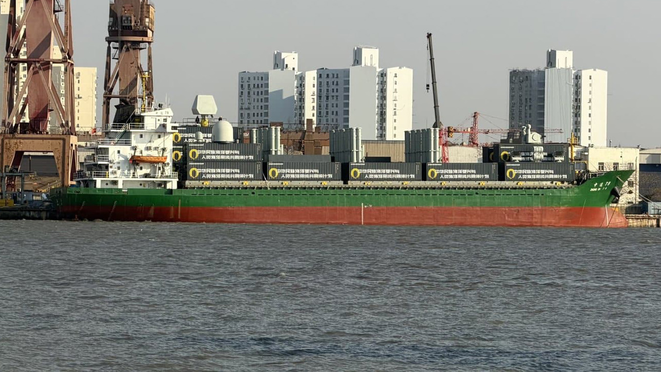 Chinese cargo ship carrying containerized modular missile launchers, highlighting the dual-use potential of commercial shipping vessels