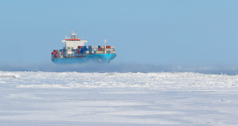 Container ship navigating through Arctic waters along the Northern Sea Route during ice-free season