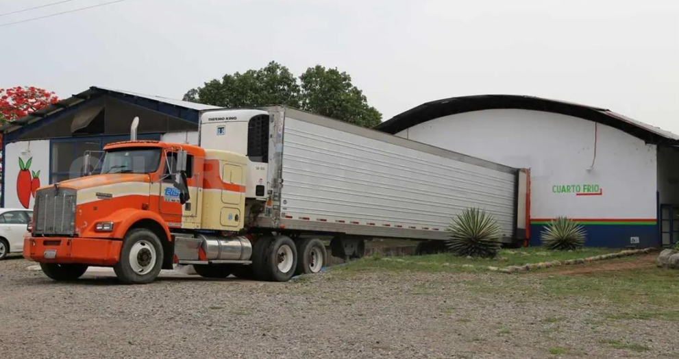 Refrigerated truck loading agricultural exports in Mexico for shipment to U.S. markets