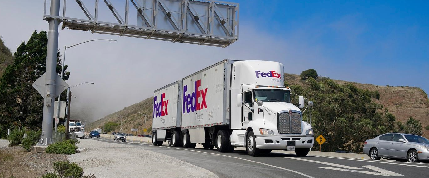 FedEx Freight truck leaving a service center after the company's 2026 spinoff as an independent LTL carrier.