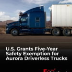 Aurora autonomous truck equipped with cab-mounted warning beacons, illustrating the U.S. five-year safety exemption for Level 4 driverless trucks.